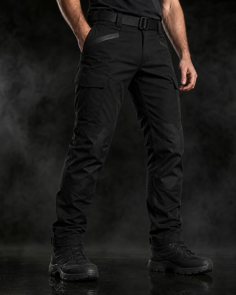 Black RIDE UNMARKED riding trousers worn with boots, studio shot against a dark background